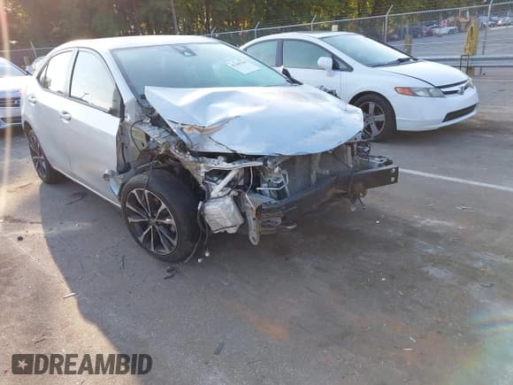 ✅ 2018 Toyota Corolla LE • VIN: 5YFBURHE6JP827476 • Lot: 43265766. Listed on IAAI with 135,859 mi. Free auction sales archive from the USA and detailed vehicle history report at DreamBid. Image 1.