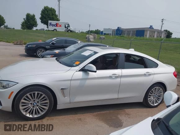 ✅ 2015 BMW 4 Series 428i xDrive • VIN: WBA4A7C51FD415440 • Lot: 42378459. Listed on IAAI with 116,445 mi. Free auction sales archive from the USA and detailed vehicle history report at DreamBid. Image 14.