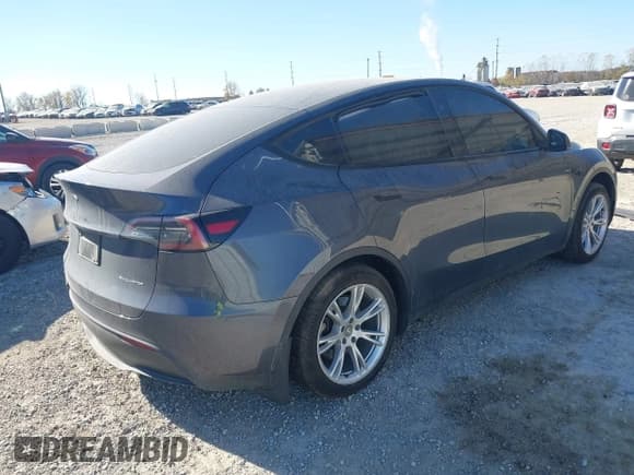 ✅ 2023 Tesla Model Y Long Range • VIN: 7SAYGDEE8PF869079 • Lot: 43620556. Listed on IAAI with 30,886 mi. Free auction sales archive from the USA and detailed vehicle history report at DreamBid. Image 4.