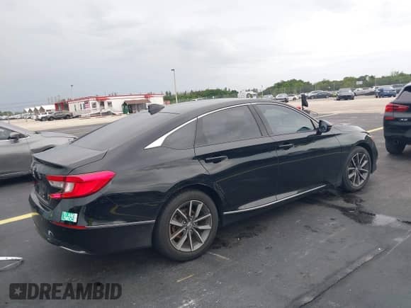 2022 Honda Accord EX-L with VIN 1HGCV1F54NA042679, listed as a IAAI auction lot 42419939 with 22,624 mi miles and . Bid and sale history available at DreamBid. Image 4.