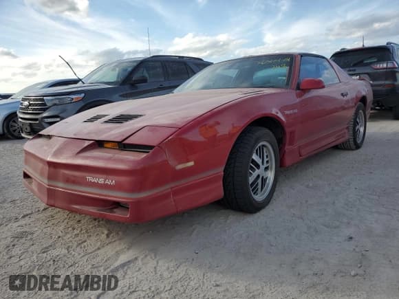 ✅ 1986 Pontiac Firebird Trans Am • VIN: 1G2FW87H0GL249284 • Lot: 76317174. Listed on Copart with 142,505 mi. Free auction sales archive from the USA and detailed vehicle history report at DreamBid. Image 1.