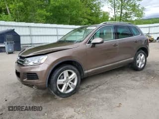 ✅ 2013 Volkswagen Touareg Exec • VIN: WVGEF9BP4DD007109 • Lot: 58890665. Listed on Copart with 157,286 mi. Free auction sales archive from the USA and detailed vehicle history report at DreamBid. Image 1.
