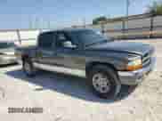 2001 Dodge Dakota Sport z VIN 1B7HL2AN61S301927, wystawiony jako Copart lot #74676094 z przebiegiem 228 616 mil mil oraz Szkoda całkowita • Salvage title. Historia ofert i sprzedaży dostępna na DreamBid. Obrazek 4.