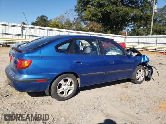 2003 Hyundai Elantra GT z VIN KMHDN55D53U101541, wystawiony jako Copart lot #76377764 z przebiegiem 170 042 mil mil oraz Szkoda całkowita • Salvage title. Historia ofert i sprzedaży dostępna na DreamBid. Obrazek 3.