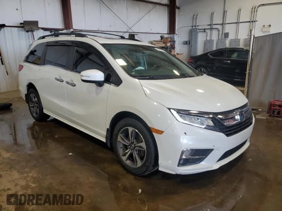 ✅ 2020 Honda Odyssey Touring • VIN: 5FNRL6H85LB032945 • Lot: 64429285. Listed on Copart with 85,696 mi. Free auction sales archive from the USA and detailed vehicle history report at DreamBid. Image 4.