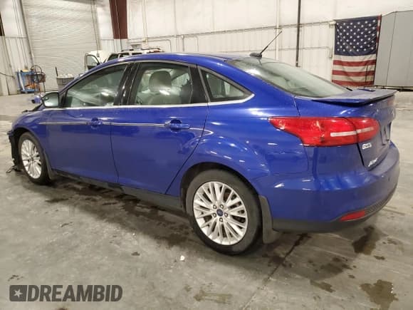 ✅ 2015 Ford Focus Titanium • VIN: 1FADP3J27FL357798 • Lot: 82706505. Wystawiony na Copart z przebiegiem Nie podano. Bezpłatny archiwum sprzedaży aukcyjnych z USA i szczegółowy raport historii pojazdu na DreamBid. Zdjęcie 2.