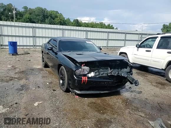 2014 Dodge Challenger SXT z VIN 2C3CDYAG0EH195293, wystawiony jako Copart lot #69801784 z przebiegiem 158 460 mil mil oraz Szkoda całkowita • Salvage title. Historia ofert i sprzedaży dostępna na DreamBid. Obrazek 11.
