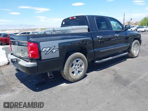 2006 Dodge Dakota SLT with VIN 1D7HE48J46S653796, listed as a IAAI auction lot 42700403 with 130,082 mi miles and . Bid and sale history available at DreamBid. Image 4.