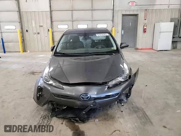 2021 Toyota Prius L Eco с VIN JTDKAMFU5M3143781, выставлен на аукционе Copart как лот 81028565 с пробегом 52 355 миль миль и Списание • Salvage title. История ставок и продаж доступна на DreamBid. Изображение 13.