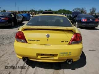 2006 Hyundai Tiburon GT z VIN KMHHN65F96U203308, wystawiony jako Copart lot #47278684 z przebiegiem 186 123 mil mil oraz Szkoda całkowita • Salvage title. Historia ofert i sprzedaży dostępna na DreamBid. Obrazek 6.