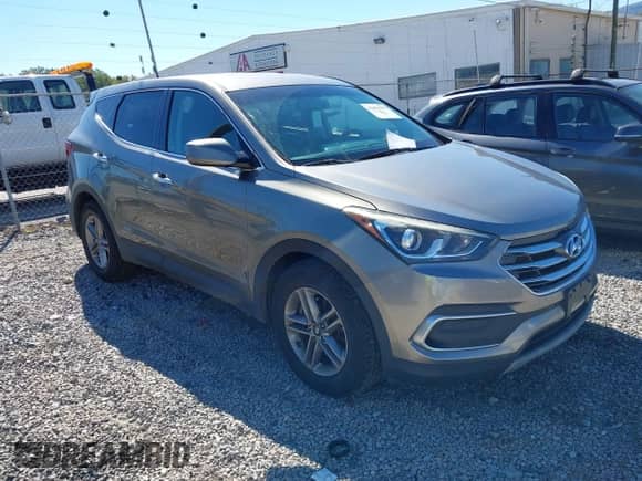 2018 Hyundai Santa Fe 2.4L z VIN 5XYZT3LB7JG556833, wystawiony jako IAAI lot #43456339 z przebiegiem 153 359 mil mil oraz . Historia ofert i sprzedaży dostępna na DreamBid. Obrazek 1.