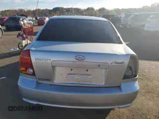 2005 Hyundai Accent GLS z VIN KMHCG45C15U635114, wystawiony jako Copart lot #87037075 z przebiegiem 64 796 mil mil oraz Szkoda całkowita • Salvage title. Historia ofert i sprzedaży dostępna na DreamBid. Obrazek 6.