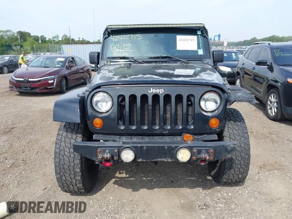 ✅ 2007 Jeep Wrangler Unlimited Sahara • VIN: 1J4GA59187L178391 • Lot: 42422715. Listed on IAAI with 134,256 mi. Free auction sales archive from the USA and detailed vehicle history report at DreamBid. Image 12.