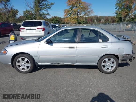 ✅ 2005 Nissan Sentra S • VIN: 3N1CB51D15L535874 • Lot: 43363683. Listed on IAAI with 166,307 mi. Free auction sales archive from the USA and detailed vehicle history report at DreamBid. Image 14.