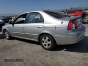 ✅ 2003 Kia Spectra GS • VIN: KNAFB161635094836 • Lot: 62873465. Listed on Copart with 117,872 mi. Free auction sales archive from the USA and detailed vehicle history report at DreamBid. Image 2.