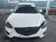 ✅ 2016 Mazda CX-5 Grand Touring • VIN: JM3KE2DY3G0863303 • Lot: 43848862. Wystawiony na IAAI z przebiegiem 95 498 mil. Bezpłatny archiwum sprzedaży aukcyjnych z USA i szczegółowy raport historii pojazdu na DreamBid. Zdjęcie 12.