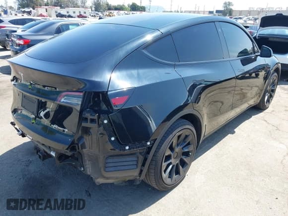 ✅ 2023 Tesla Model Y Long Range • VIN: 7SAYGDEE0PA023719 • Lot: 41974415. Listed on IAAI with 50,152 mi. Free auction sales archive from the USA and detailed vehicle history report at DreamBid. Image 4.