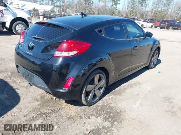 2012 Hyundai Veloster w/Black Int with VIN KMHTC6AD8CU046029, listed as a IAAI auction lot 41664151 with 163,523 mi miles and . Bid and sale history available at DreamBid. Image 4.