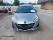 ✅ 2014 Mazda 5 Touring • VIN: JM1CW2CL7E0175902 • Lot: 43287647. Listed on IAAI with 98,037 mi. Free auction sales archive from the USA and detailed vehicle history report at DreamBid. Image 12.