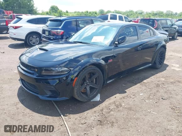 ✅ 2023 Dodge Charger Scat Pack Widebody • VIN: 2C3CDXGJ6PH671756 • Lot: 42354271. Listed on IAAI with 21,387 mi. Free auction sales archive from the USA and detailed vehicle history report at DreamBid. Image 2.