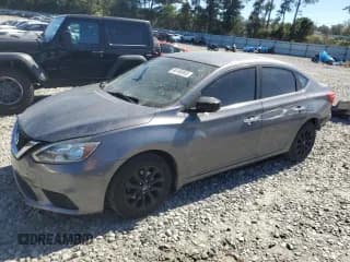 ✅ 2018 Nissan Sentra S • VIN: 3N1AB7AP7JY256438 • Лот: 86186965. Опубликован ранее на Copart с пробегом 117 284 миль. Бесплатный доступ к архиву аукционных продаж из США и подробный отчёт об истории автомобиля на DreamBid. Изображение 1.