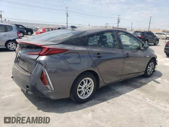 2021 Toyota Prius LE z VIN JTDKAMFP7M3176372, wystawiony jako Copart lot #68893794 z przebiegiem 59 421 mil mil oraz Szkoda całkowita • Salvage title. Historia ofert i sprzedaży dostępna na DreamBid. Obrazek 3.