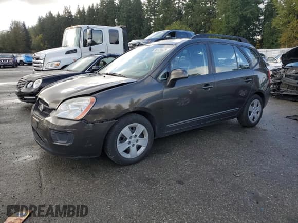 ✅ 2009 Kia Rondo LX • VIN: KNAFG528297269155 • Лот: 90724425. Опубликован ранее на Copart с пробегом 184 346 миль. Бесплатный доступ к архиву аукционных продаж из США и подробный отчёт об истории автомобиля на DreamBid. Изображение 1.
