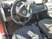 ✅ 2009 Smart fortwo Pure • VIN: WMEEJ31X89K240206 • Lot: 92012945. Listed on Copart with 62,396 mi. Free auction sales archive from the USA and detailed vehicle history report at DreamBid. Image 8.