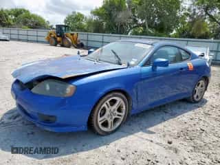 2005 Hyundai Tiburon GS с VIN KMHHM65DX5U168343, выставлен на аукционе Copart как лот 58749085 с пробегом Не указан миль и Чистый • Clean title. История ставок и продаж доступна на DreamBid. Изображение 1.