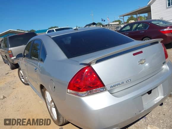 2013 Chevrolet Impala LTZ with VIN 2G1WC5E31D1259729, listed as a IAAI auction lot 43456334 with 163,385 mi miles and . Bid and sale history available at DreamBid. Image 3.