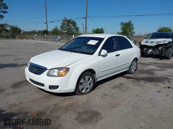 ✅ 2009 Kia Spectra EX • VIN: KNAFE221295656744 • Lot: 43283836. Listed on IAAI with 213,956 mi. Free auction sales archive from the USA and detailed vehicle history report at DreamBid. Image 2.