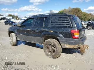 ✅ 2003 Jeep Grand Cherokee Laredo • VIN: 1J4GW48S03C566103 • Лот: 90809575. Опубликован ранее на Copart с пробегом 208 186 миль. Бесплатный доступ к архиву аукционных продаж из США и подробный отчёт об истории автомобиля на DreamBid. Изображение 2.