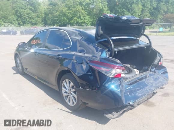 2021 Toyota Camry LE z VIN 4T1C11BK7MU020531, wystawiony jako IAAI lot #42761835 z przebiegiem 56 145 mil mil oraz . Historia ofert i sprzedaży dostępna na DreamBid. Obrazek 3.