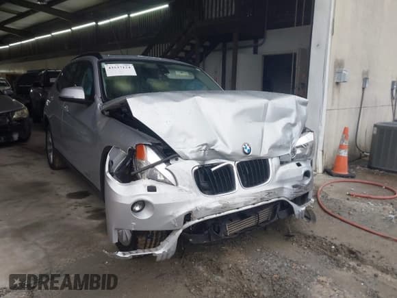✅ 2014 BMW X1 xDrive28i • VIN: WBAVL1C50EVY12027 • Lot: 43537124. Listed on IAAI with 84,465 mi. Free auction sales archive from the USA and detailed vehicle history report at DreamBid. Image 1.