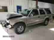 1999 Chevrolet Blazer LS with VIN 1GNDT13W9X2105768, listed as a Copart auction lot 80141174 with 193,804 mi miles and Salvage title. Bid and sale history available at DreamBid. Image 1.