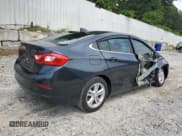 ✅ 2017 Chevrolet Cruze LT • VIN: 1G1BE5SMXH7134257 • Lot: 58479743. Listed on Copart with 77,218 mi. Free auction sales archive from the USA and detailed vehicle history report at DreamBid. Image 3.