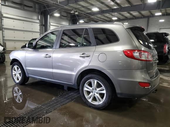 2012 Hyundai Santa Fe Limited с VIN 5XYZKDAGXCG152385, выставлен на аукционе Copart как лот 63775244 с пробегом 149 243 миль миль и Списание • Salvage title. История ставок и продаж доступна на DreamBid. Изображение 2.
