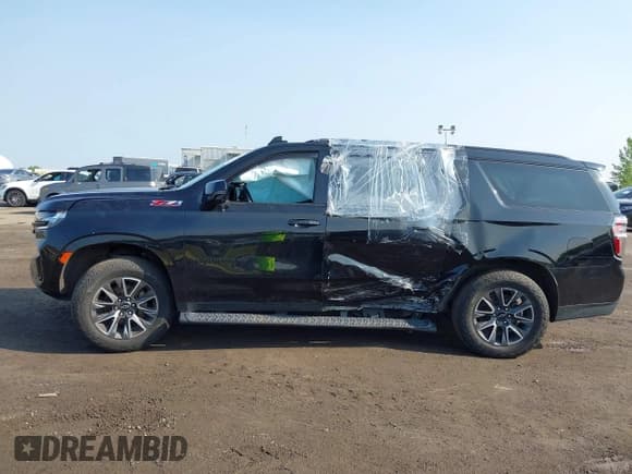 ✅ 2023 Chevrolet Suburban Z71 • VIN: 1GNSKDKD0PR327831 • Lot: 42449967. Listed on IAAI with 68,920 mi. Free auction sales archive from the USA and detailed vehicle history report at DreamBid. Image 14.