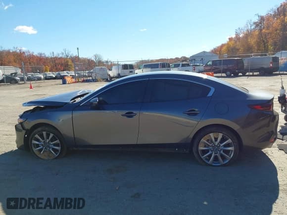 ✅ 2023 Mazda 3 S Select • VIN: 3MZBPABMXPM358463 • Lot: 43643544. Listed on IAAI with 56,857 mi. Free auction sales archive from the USA and detailed vehicle history report at DreamBid. Image 14.