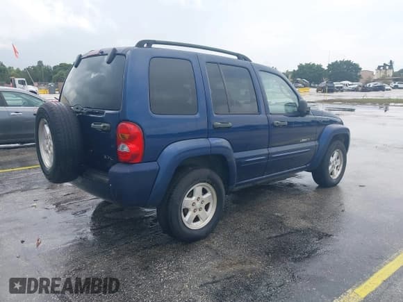 ✅ 2002 Jeep Liberty Limited • VIN: 1J4GL58K12W320799 • Lot: 43157116. Listed on IAAI with 142,082 mi. Free auction sales archive from the USA and detailed vehicle history report at DreamBid. Image 4.