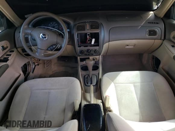 ✅ 2003 Mazda Protege DX • VIN: JM1BJ226730103729 • Lot: 63227285. Listed on Copart with 185,866 mi. Free auction sales archive from the USA and detailed vehicle history report at DreamBid. Image 8.