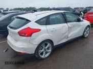 ✅ 2016 Ford Focus Titanium • VIN: 1FADP3N26GL387872 • Lot: 42183397. Listed on IAAI with 30,557 mi. Free auction sales archive from the USA and detailed vehicle history report at DreamBid. Image 4.
