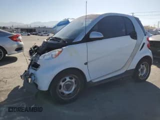 ✅ 2015 Smart fortwo Passion • VIN: WMEEJ3BA8FK794805 • Лот: 67224325. Опубликован ранее на Copart с пробегом 69 876 миль. Бесплатный доступ к архиву аукционных продаж из США и подробный отчёт об истории автомобиля на DreamBid. Изображение 1.
