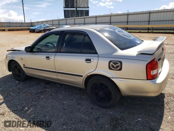✅ 2003 Mazda Protege DX • VIN: JM1BJ226730103729 • Lot: 63227285. Listed on Copart with 185,866 mi. Free auction sales archive from the USA and detailed vehicle history report at DreamBid. Image 2.