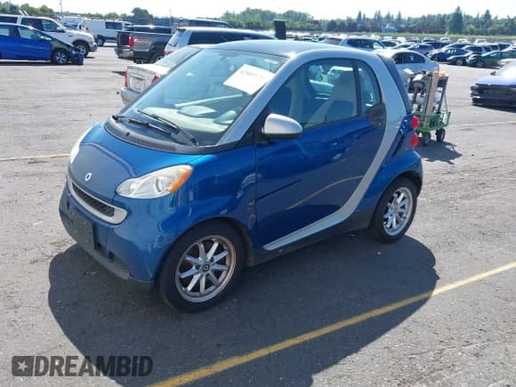 ✅ 2009 Smart fortwo Pure • VIN: WMEEJ31X19K243304 • Лот: 42860139. Опубликован ранее на IAAI с пробегом 119 617 миль. Бесплатный доступ к архиву аукционных продаж из США и подробный отчёт об истории автомобиля на DreamBid. Изображение 2.