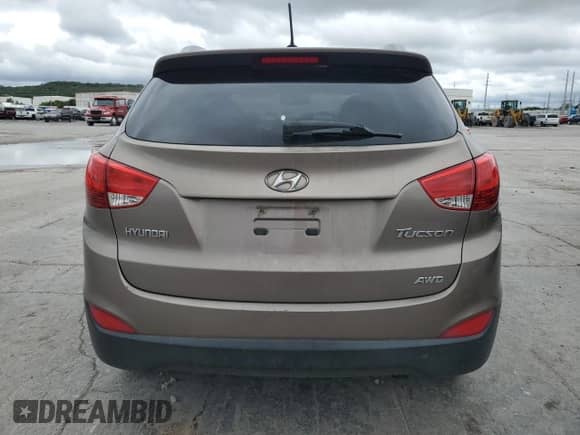 2011 Hyundai Tucson Limited with VIN KM8JUCAC0BU224654, listed as a Copart auction lot 83989635 with 168,610 mi miles and Salvage title. Bid and sale history available at DreamBid. Image 6.