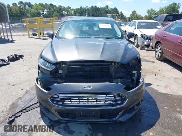 ✅ 2016 Ford Fusion Titanium • VIN: 3FA6P0D98GR140845 • Lot: 43094568. Listed on IAAI with 205,129 mi. Free auction sales archive from the USA and detailed vehicle history report at DreamBid. Image 12.