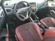 2012 Hyundai Veloster w/Red Int с VIN KMHTC6AD4CU076435, выставлен на аукционе Copart как лот 73015964 с пробегом 136 324 миль миль и Списание • Salvage title. История ставок и продаж доступна на DreamBid. Изображение 8.