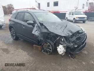 ✅ 2016 Mazda CX-5 Grand Touring • VIN: JM3KE4DY4G0830998 • Lot: 43517605. Wystawiony na IAAI z przebiegiem 123 585 mil. Bezpłatny archiwum sprzedaży aukcyjnych z USA i szczegółowy raport historii pojazdu na DreamBid. Zdjęcie 1.