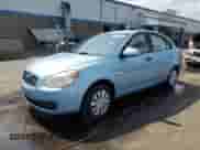2007 Hyundai Accent GLS z VIN KMHCN46C77U110811, wystawiony jako Copart lot #61494715 z przebiegiem 151 522 mil mil oraz Szkoda całkowita • Salvage title. Historia ofert i sprzedaży dostępna na DreamBid. Obrazek 1.